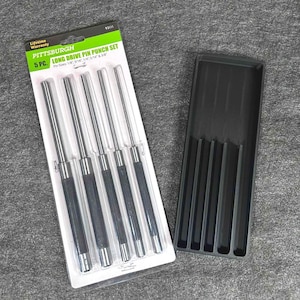 May include: A 5-piece long drive pin punch set by Pittsburgh. The set includes punches in the following sizes: 1/16", 3/32", 1/8", 5/32", and 3/16". The punches have black handles and are packaged in a clear plastic container, next to a black tray.