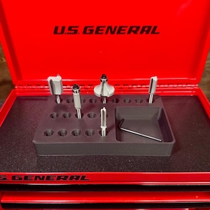 May include: Red metal toolbox with a black foam insert for storing router bits. The toolbox has the text "U.S. GENERAL" printed on the top and the bottom.