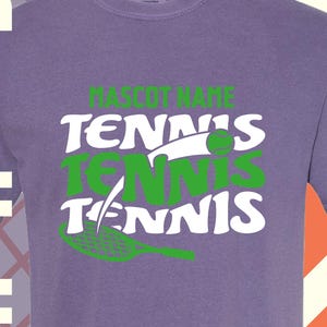 May include: A purple t-shirt with the words "MASCOT NAME TENNIS TENNIS TENNIS" in white and green. A tennis ball graphic is on the right side of the shirt. The background has a tennis-themed design.
