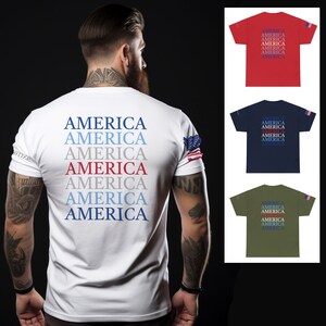 May include: A white t-shirt with the word "AMERICA" repeated seven times in blue, red, and white. The shirt has a small American flag on the right sleeve.