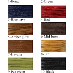 May include: A chart showing 11 different colors of thread. The colors are beige, green, blue navy, red, amber glow, mid-brown, Havana, tan, pea green, black, and beetroot.