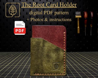 May include: A handmade leather card holder with a two-tone design. The top section is burgundy, and the bottom is olive green. The text "The Root Card Holder" is displayed above the card holder, along with "digital PDF pattern + Photos & instructions."