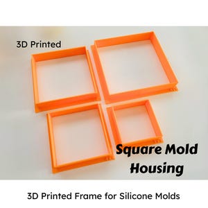May include: Four orange 3D-printed square mold housings of varying sizes. The text "3D Printed" is above the frames, and "Square Mold Housing" is to the right. Below, the text reads "3D Printed Frame for Silicone Molds."