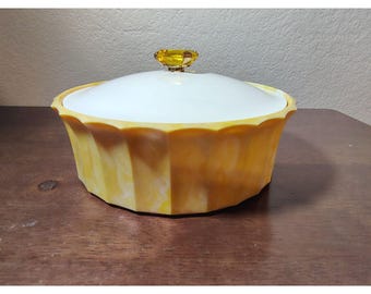 Envase vintage de plástico con pomo de joya color amarillo topacio de Avon Beauty, estilo kitsch.