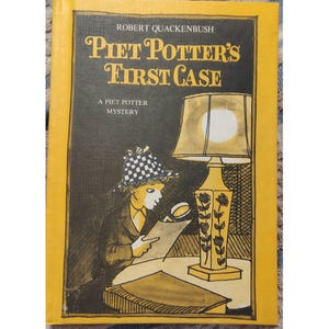 May include: A vintage book cover titled "Piet Potter's First Case" by Robert Quackenbush. The illustration shows a detective with a magnifying glass, a lamp, and a table. The book has a yellow border and the text "A Piet Potter Mystery".