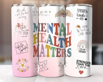 May include: Three pink and white tumblers with various mental health affirmations and illustrations. The tumblers feature phrases like "Mental Health Matters", "You Are Enough", "Tomorrow Needs You", and "Be Kind To Your Mind".