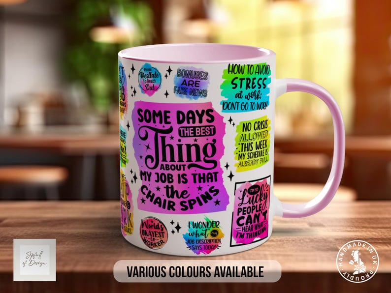 May include: A pink and white ceramic mug with a variety of colourful text and designs. The text includes phrases like "Some days the best thing about my job is that the chair spins" and "How to avoid stress at work: Don't go to work".