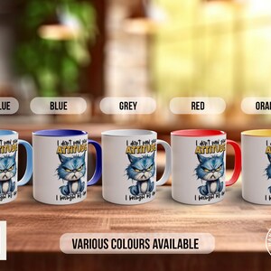 May include: Five ceramic mugs with a grumpy cat design. The mugs are available in light blue, blue, grey, red, and orange. The text on the mugs reads "I don't need your attitude I brought my own".