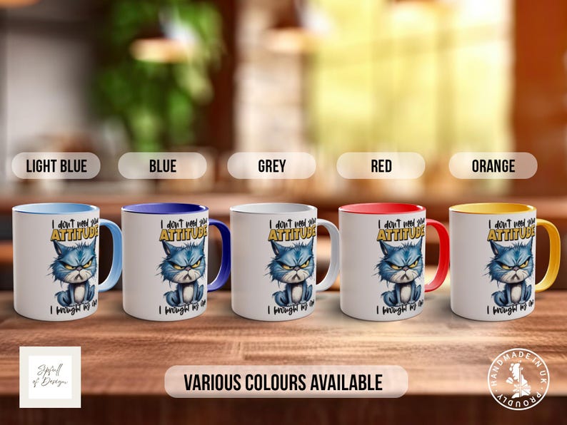 May include: Five ceramic mugs with a grumpy cat design. The mugs are available in light blue, blue, grey, red, and orange. The text on the mugs reads "I don't need your attitude I brought my own".