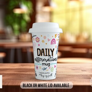 May include: White travel mug with a colorful design featuring flowers, stars, and rainbows. The mug says "Daily affirmations mug" and "I will stay positive and keep my faith". Black or white lid available.