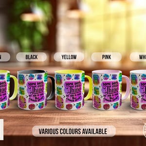May include: Five ceramic mugs with a colourful design and the text "Some days the only thing about my job is the chair spins". The mugs are in different colours: green, black, yellow, pink, and white.
