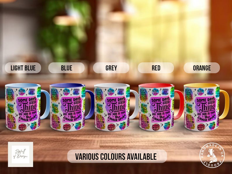May include: Five mugs with different coloured rims, light blue, blue, grey, red, and orange. Each mug has a white background with a colourful design and the text "Some days the best thing about my job is that the chair spins".