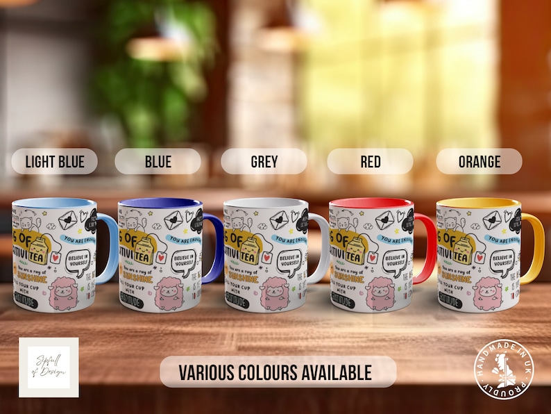 May include: Five mugs with different coloured rims, each featuring a white background with black and white doodles and the text "A cup of positivity tea. You are a ray of sunshine. Believe in yourself." The mugs are light blue, blue, grey, red, and orange.