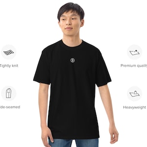May include: Black t-shirt with a small white "B" embroidered on the chest. The t-shirt is made of a tightly knit, heavyweight fabric and has side seams.