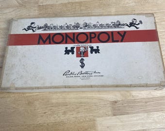 Juego de Monopoly vintage de la década de 1940, época de la Segunda Guerra Mundial, de Parker Bros., con fichas compuestas. Raro.