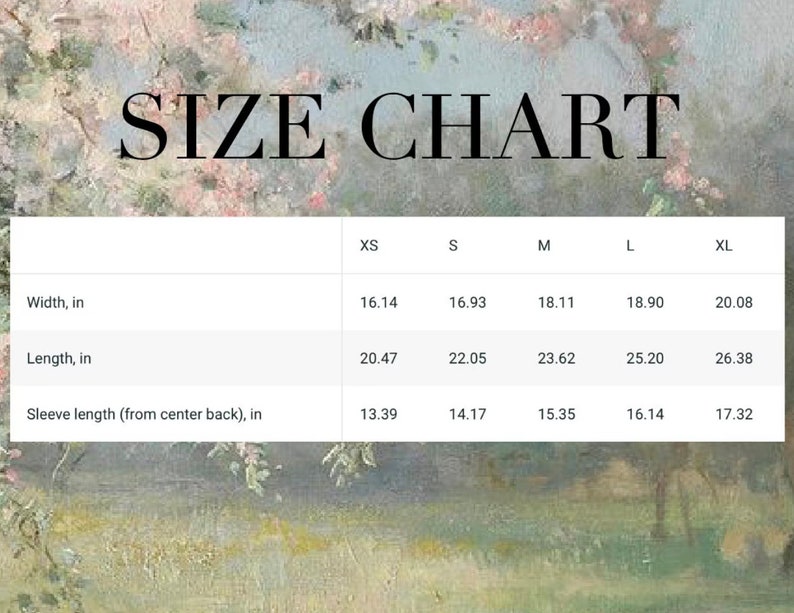 May include: A size chart with measurements in inches for XS, S, M, L, and XL. The chart includes width, length, and sleeve length measurements. The background features a soft, impressionistic floral and landscape design.