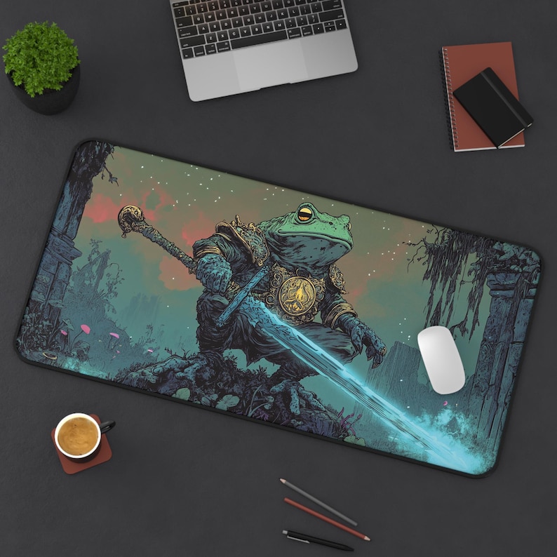 Fantasy artwork of a frog knight with a glowing sword. Large extended desk mat, non-slip base, vibrant print, durable hemmed edges. Makes a unique gift for fantasy and gaming lovers.