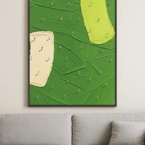 May include: Abstract art print featuring a textured green background with yellow and cream-colored brushstrokes. Tiny figures are scattered across the green field, creating a sense of scale and depth. The artwork is framed in a dark, rectangular frame.