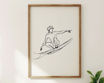 May include: A black and white line drawing of a person surfing on a wave. The drawing is framed in a light wood frame and is hanging on a white wall.
