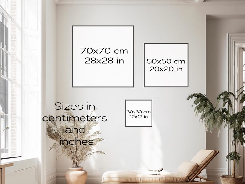 May include: A white wall with three framed pieces of paper showing different sizes of prints in both inches and centimetres. The text reads: "70x70 cm 28x28 in", "50x50 cm 20x20 in", and "30x30 cm 12x12 in". The text "Sizes in centimetres and inches" is also visible.