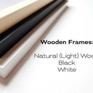 May include: Three wooden picture frames stacked on top of each other. The top frame is natural wood, the middle frame is black, and the bottom frame is white. The text "Wooden Frames: Natural (Light) Wood Black White" is below the frames.