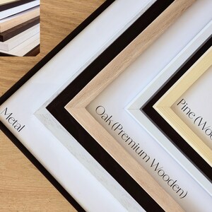 May include: Close-up of five different picture frames, showing the different materials they are made of. The frames are arranged in a diagonal line, with the metal frame at the bottom and the pine frame at the top. The frames are labelled with their material: Metal, Oak (Premium Wooden), Pine (Wooden).