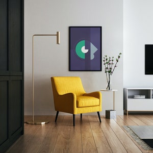May include: A yellow armchair with black legs sits in a living room with a black cabinet, a gold floor lamp, a white coffee table, a vase with pink flowers, a framed abstract print, and a flat screen TV on a white entertainment center.