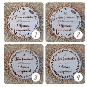 May include: Four wooden coasters with a floral design and text that reads "UNE Soeur formidable fait toujours une Marraine exceptionnelle"  "UNE Amie formidable fait toujours une Marraine exceptionnelle"  "UN Fr&egrave;re formidable fait toujours un Parrain exceptionnel"  "UN Ami formidable fait toujours un Parrain exceptionnel".