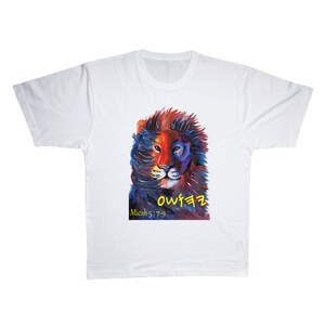 May include: White t-shirt with a colorful painting of a lion's head. The lion's mane is red, orange, blue, and purple. The text "owf7z" and "Micah 5:7-9" is printed in yellow below the lion.
