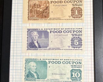 May include: Three vintage US Department of Agriculture food coupons. The coupons are printed on blue, green, and brown paper. The coupons are for 1, 5, and 10 dollars. The coupons are non-transferable and are valid only under conditions prescribed by the Secretary of Agriculture.