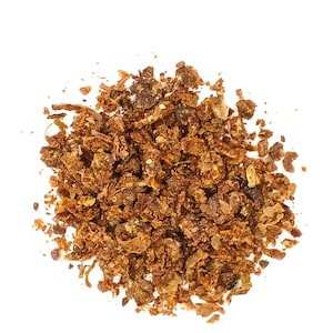 Può includere: Primo piano di un mucchio di scorza d'arancia secca, un ingrediente comune nella cottura e nella cucina.