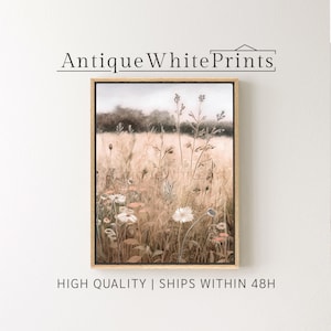 May include: A framed print of a watercolor painting depicting a field of wildflowers in shades of brown, beige, and white. The flowers are in bloom and the background is a soft, blurred landscape.