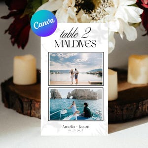 以下が含まれることがあります： table 2 MALDIVESという文字、カップルの横向き写真2枚、そして下部に黒のセリフ体で印刷されたAmeliaとJasonの名前および日付01.25.2027が記載された、長方形の白いテーブルナンバーカード。