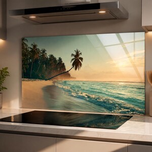 May include: A rectangular kitchen splashback panel featuring a high-resolution print of a tropical beach at sunset. The image displays a sandy shore, turquoise ocean waves, and a line of palm trees under a soft, golden-hued sky.