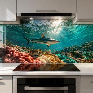 May include: A kitchen splashback panel featuring a high-resolution underwater scene with a shark swimming above a vibrant coral reef. The image displays deep blue water, sunlight filtering from the surface, and colourful coral formations.
