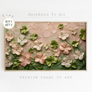 May include: A framed painting of pink and white flowers with green leaves on a light pink background. The painting has a textured, 3D effect. The text "Aesthetic Tv Art" is written above the painting and "Premium Frame Tv Art" is written below the painting.