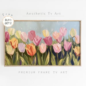 以下が含まれることがあります： ピンク、イエロー、オレンジ、パープルなど、カラフルなチューリップ畑を描いた絵画。チューリップは、筆跡がはっきりとした、ゆったりとした印象派のスタイルで描かれています。背景は柔らかなブルーで、晴れた空を連想させます。絵画は、シンプルな木製フレームに収められています。