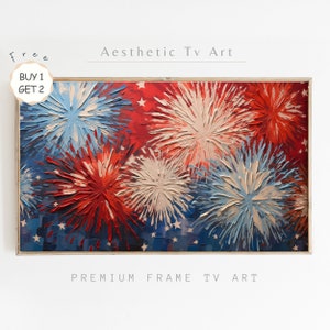 May include: A framed painting of red, white, and blue fireworks exploding against a blue background with white stars. The painting is in a light wood frame. The text "Aesthetic Tv Art" is above the painting and "Premium Frame Tv Art" is below the painting.