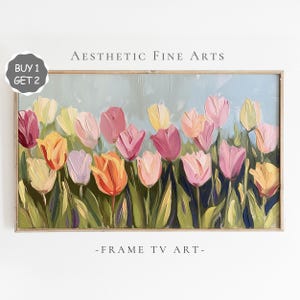 May include: Framed artwork of colorful tulips in shades of pink, orange, and yellow against a light blue background. The painting is in a wooden frame, with the text "-FRAME TV ART-" at the bottom. The text "Aesthetic Fine Arts" is at the top.