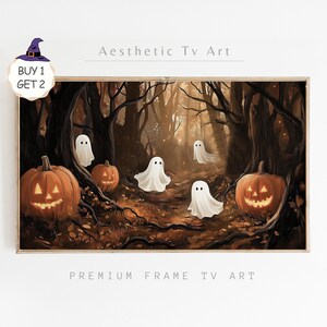 May include: A digital art print featuring a spooky forest scene with glowing jack-o'-lanterns and white ghosts. The print has the text "Aesthetic Tv Art" and "Premium Frame Tv Art" at the top and bottom.