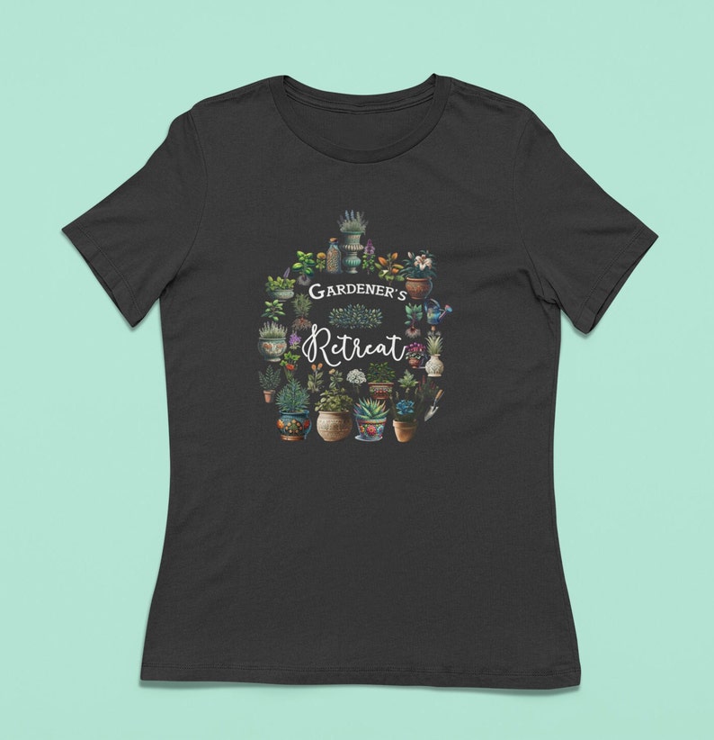 May include: Black t-shirt with a white graphic of a circle of potted plants and the text "GARDENER'S Retreat".