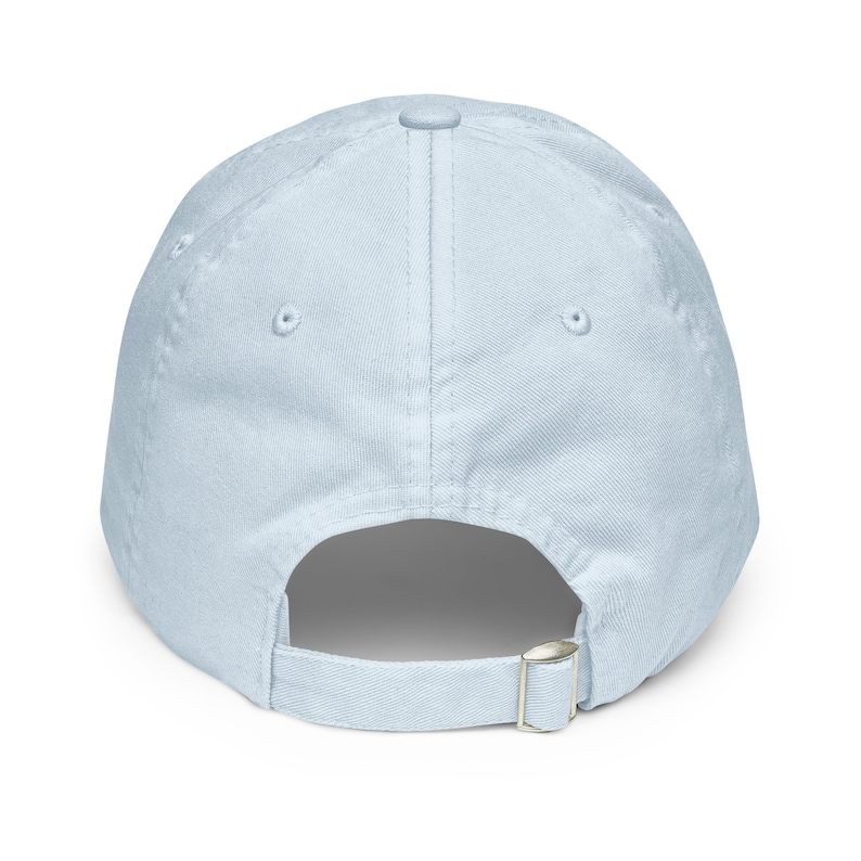 May include: A light blue baseball cap with an adjustable strap in the back.
