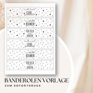 Puede incluir: Un papel blanco con seis diseños rectangulares, cada uno con texto y pequeños corazones negros. Las frases incluyen "mit viel LIEBE gemacht", "anstatt BLUMEN" y "FÜR DICH von HERZEN". La parte inferior del papel dice "BANDEROLEN VORLAGE ZUM SOFORTDRUCK".