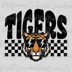 May include: A digital design featuring the word "TIGERS" in bold black letters above a tiger wearing sunglasses with lightning bolt lenses. A black and white checkered pattern is below the tiger.