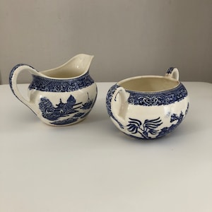 Vintage blue willow creamer and sugar bowl