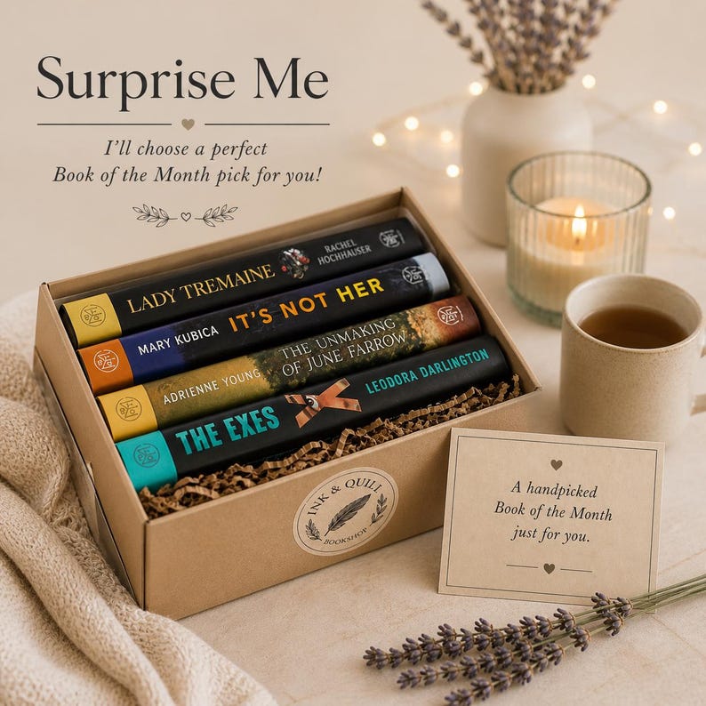 May include: A cardboard gift box containing four books titled Lady Tremaine, It's Not Her, The Unmaking of June Farrow, and The Exes. The box features an Ink & Quill Bookshop sticker and includes a card that reads A handpicked Book of the Month just for you.