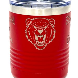 May include: Red stainless steel travel mug with a bear graphic and the text "Stay Hungry,  Carry On".