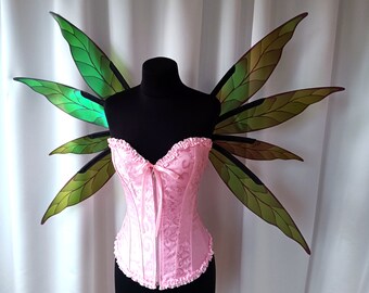 Bright green iridescent elf wings in the form of hemp leaves, green fairy wings in the shape of hemp leaves