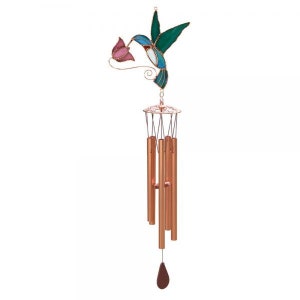 May include: A stained glass hummingbird wind chime with a pink flower. The chime has copper colored tubes and a brown wooden clapper.