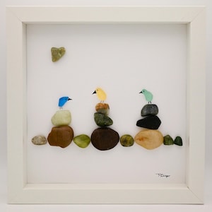sea glass birds, sea glass handmade art, sea glass wall decor, 3 colorful birds designed from sea glass atop colorful rocks